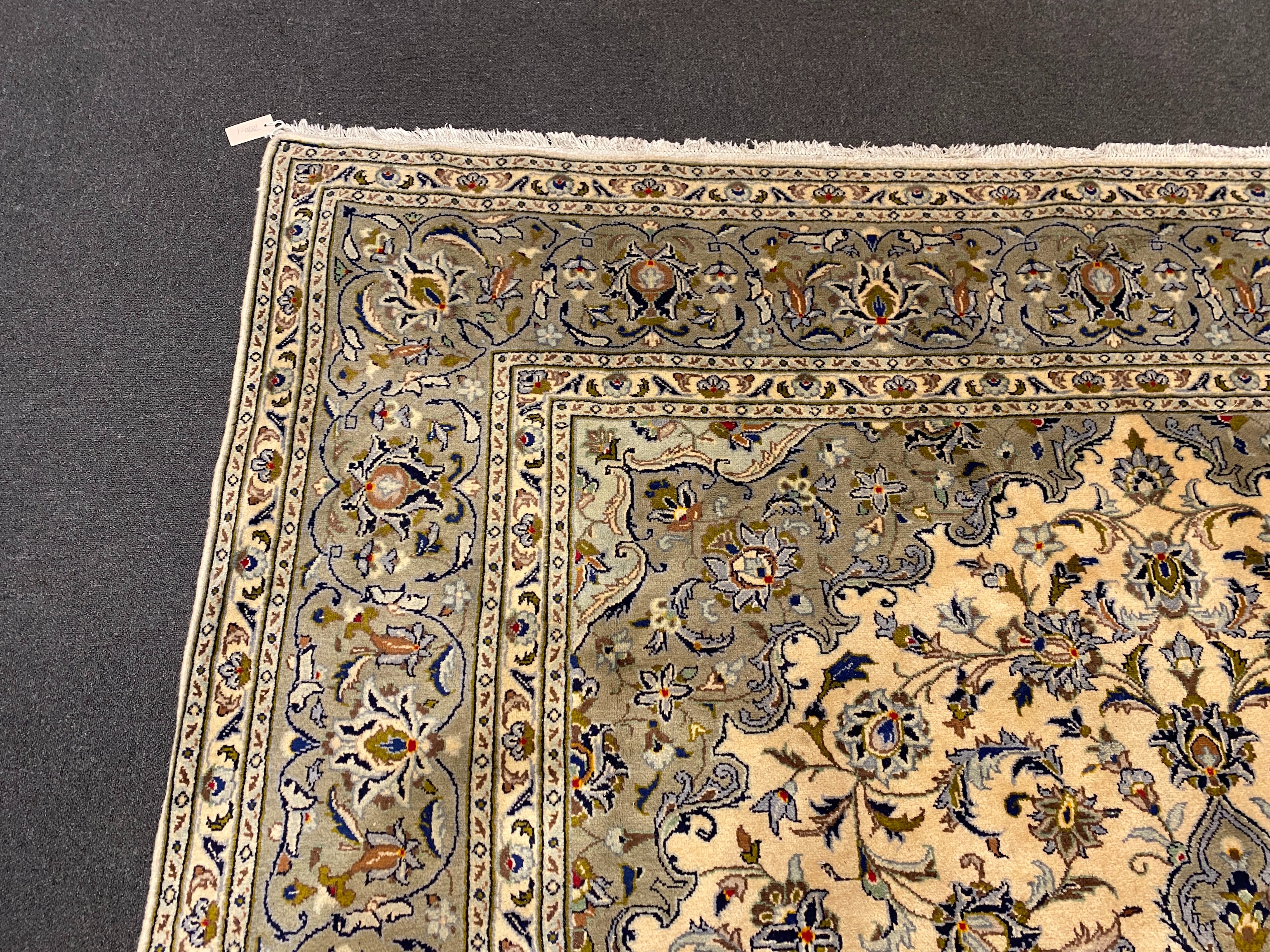 A Kashan ivory ground carpet, 355cm x 246cm